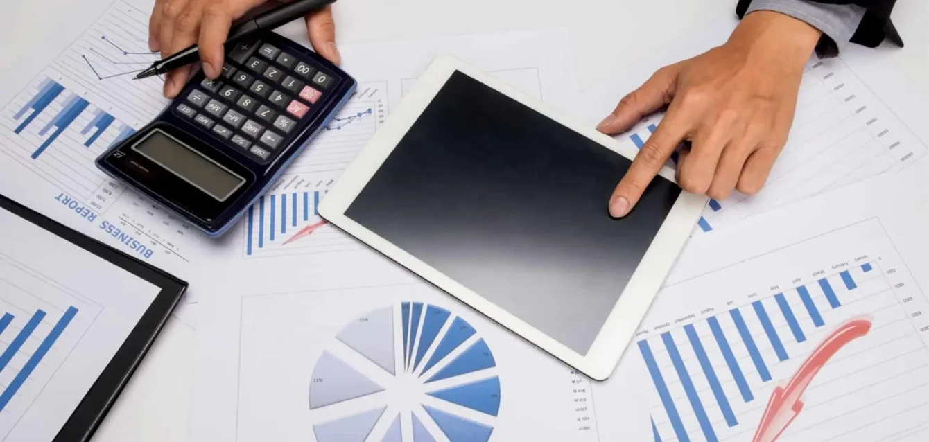 business-documents-office-table-with-smart-phone-digital-tablet-man-working-background2-scaled