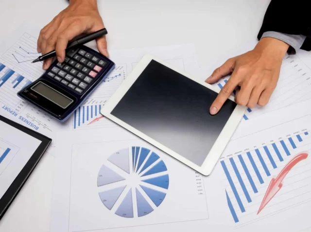 business-documents-office-table-with-smart-phone-digital-tablet-man-working-background2-scaled